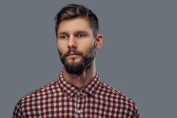 Portrait of bearded man in a red shirt.