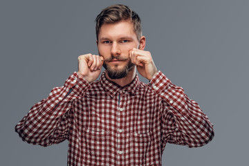 Portrait of bearded man in a red shirt.