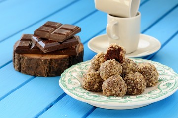 Homemade tasty chocolate truffles, chocolate bars and coffee cup