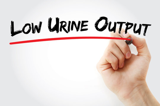 Hand writing low urine output with marker, concept background