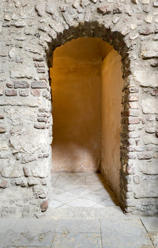 Aged narrow dark vaulted passage, Medieval Cairo, Egypt