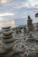 Pile of pebbles in balance at sunset