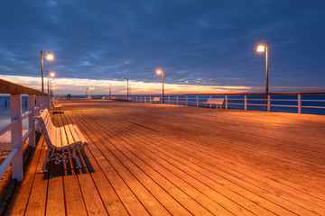 Cold evening at the pier in Jastrania in winter time. Poland. 