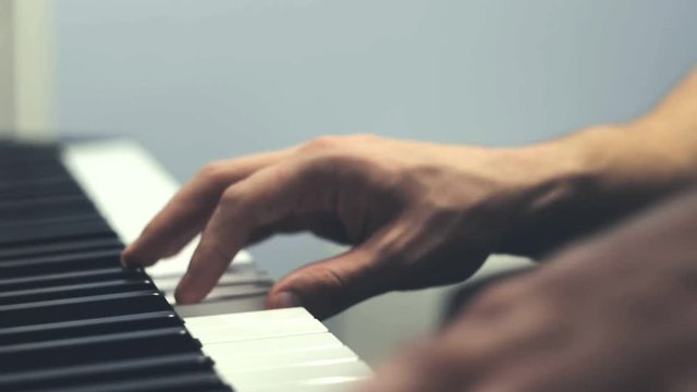 Playing piano. Close Up view. Two hands playing the piano.