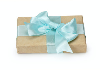 Gift box with present wrapped in kraft paper and blue bowknot bo