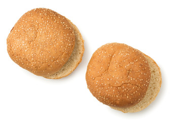 Pair of hamburger bun sprinkled with sesame seeds isolated on a