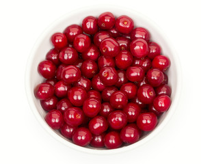 Bowl of fresh red cherries isolated on a white background, top v