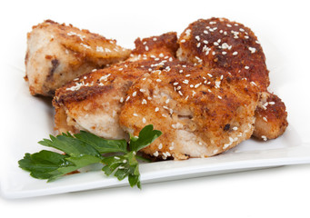 Fried chicken pieces coated with breadcrumbs with with parsley,