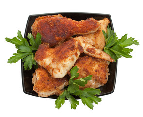 Fried chicken pieces coated with breadcrumbs with with parsley o