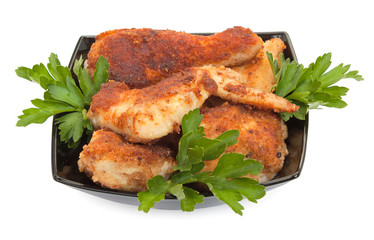 Fried chicken pieces coated with breadcrumbs with with parsley o