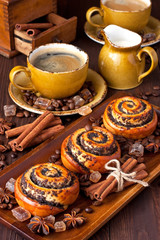 Cup of coffee with  sweet buns and coffee beans