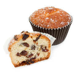 Half of homemade muffin with raisins, and the whole muffin close