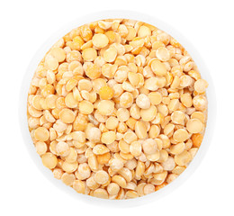 Dried peas in round plate isolated on a white background top vie