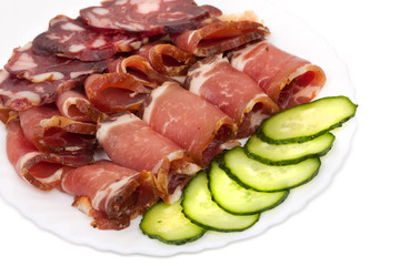 Sliced homemade dry sausages and meat products, cured meat, baco