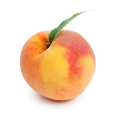Fresh ripe juicy red peach with green leaf isolated on a white b