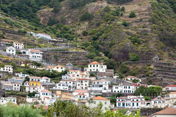 Fototapeta na wymiar Fields and houses along west coast near Porto Moniz on Madeira Island. Portugal