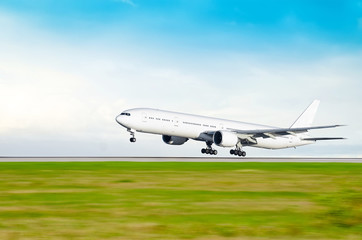 Airplane landing at the airport - obrazy, fototapety, plakaty