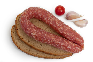 Background with home smoked sausage, bread, tomatoes and garlic