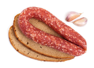 Background with smoked sausage, bread and garlic cloves. Isolate