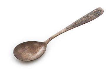 Very old rusty vintage silver spoon isolated on a white backgrou