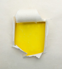 Torn paper with yellow background