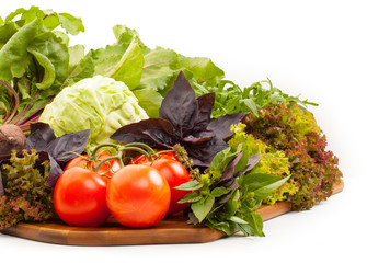 Fresh organic vegetables for cooking food on wooden cutting boar
