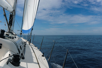Fototapeta na wymiar Yacht sailing in Mediterranean sea near Italy