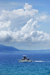 Fishing boat in deep blue ocean offshore in Dominican republic.