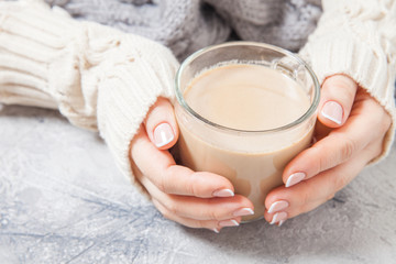 Female hands with coffee drink