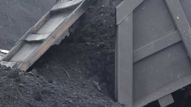 Coal truck pours out of stock