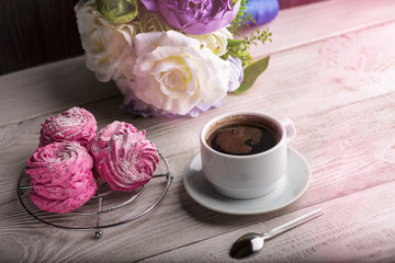 Black coffee and pink zephyr. marshmallow. Sweet pink marshmallow - zephyr and cup of Coffee. Christmas Still Life. Winter drink theme. Romance. Provencal still life. Good morning