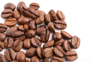 roasted coffee beans isolated in white background. Roasted coffee beans background close up. Coffee beans pile from top on white background with copy space for text. Good morning.