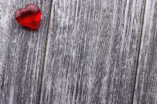 Red Heart on the gray painted wooden background