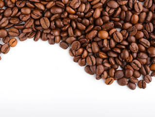 roasted coffee beans isolated in white background. Roasted coffee beans background close up. Coffee beans pile from top on white background with copy space for text. Good morning.