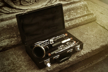 beautiful black and silver clarinet in classic case on backgroun