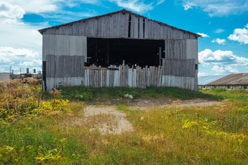 Large wooden shed, garage on the edge of the village.