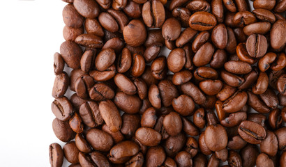 roasted coffee beans isolated in white background. Roasted coffee beans background close up. Coffee beans pile from top on white background with copy space for text. Good morning.