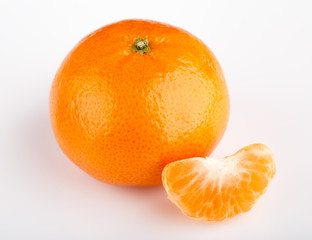 Ripe mandarin close-up on a white background. Tangerine orange. Colorful Food and drink still life concept. Fresh fruits and vegetables on color background. Clementine. Citrus. Fresh fruits. Diet.