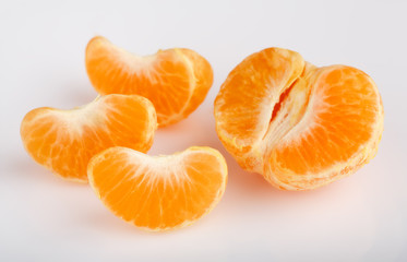 Ripe mandarin close-up on a white background. Tangerine orange. Colorful Food and drink still life concept. Fresh fruits and vegetables on color background. Clementine. Citrus. Fresh fruits. Diet.