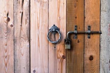 Door with Wooden Planks and Passing Padlock