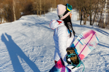 Fototapeta na wymiar Photography of brunette with snowboard