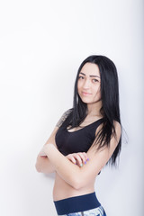 Fototapeta premium Cheerful athletic woman brunette. Woman in black sports top