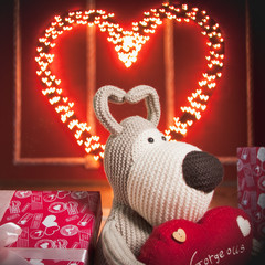 Red heart with the garland and lovely dog