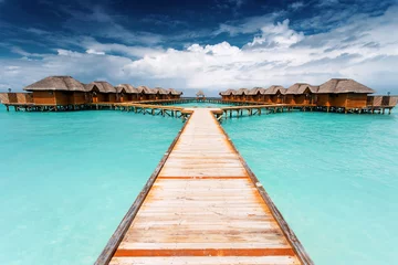Fotobehang Water bungalows resort at islands. Indian Ocean, Maldives © Ivan Kurmyshov