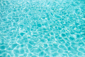 Blue clear transparent water background with sand