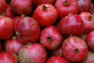 Fresh red ripe pomegranates close up