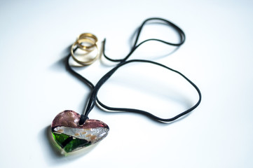 wooden magic amulet in the shape of heart. Selective focus.