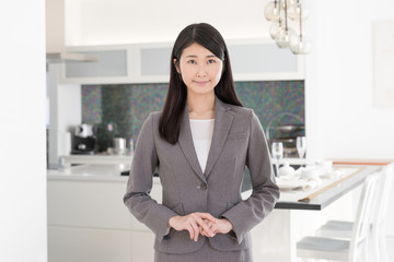 asian businesswoman in the kitchen