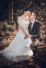 Toned photo, bride and groom hugging outdoor