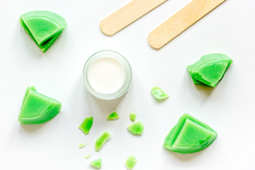 concept depilation with wax on white background top view